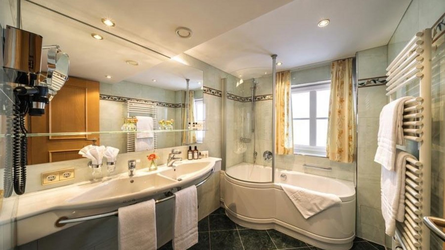 Modern bathroom featuring a stylish bathtub, sleek sink, and contemporary fixtures