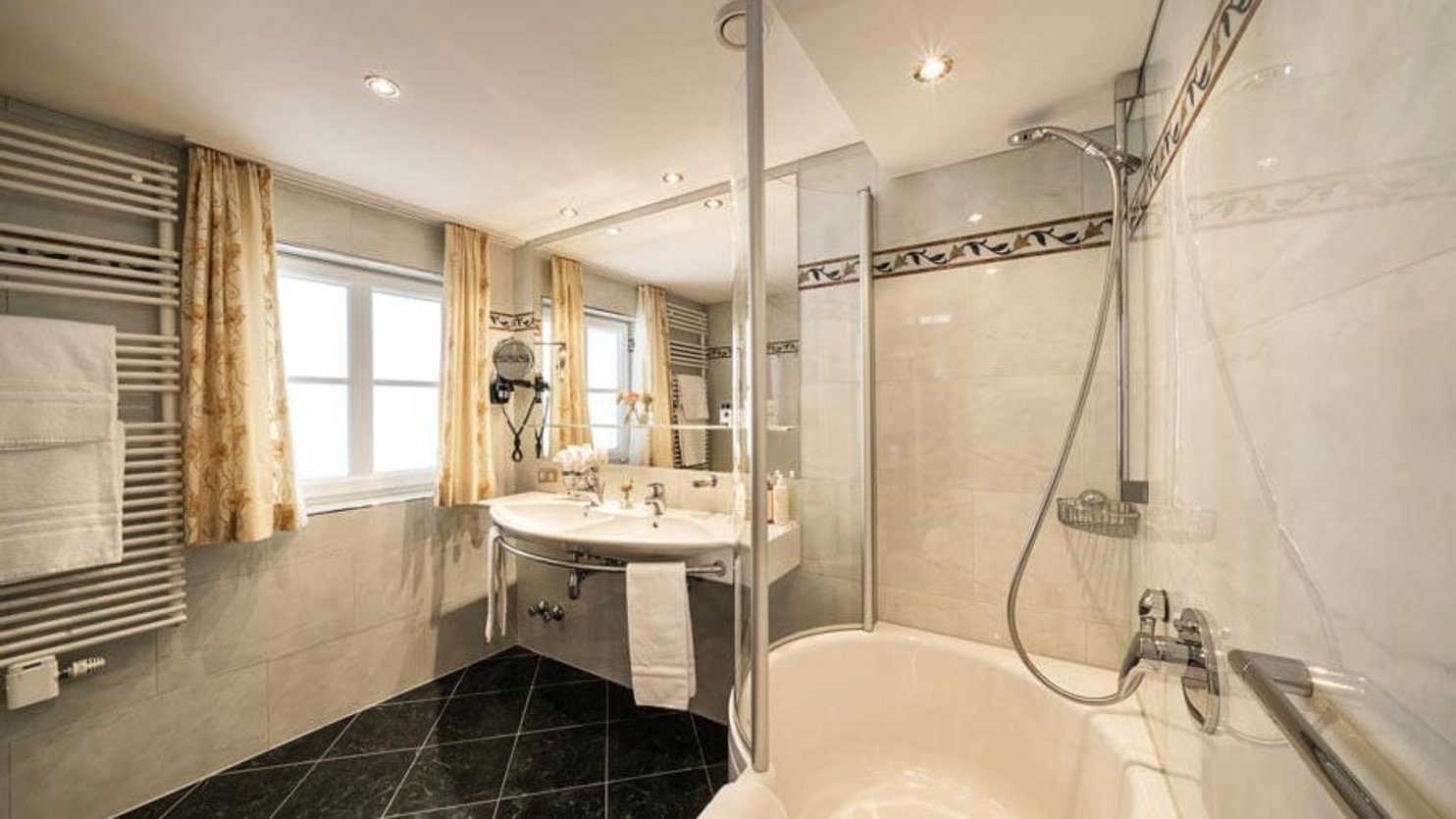 Sleek Modern Bathroom Design A contemporary bathroom with a glass shower and elegant fixtures featuring a bathtub